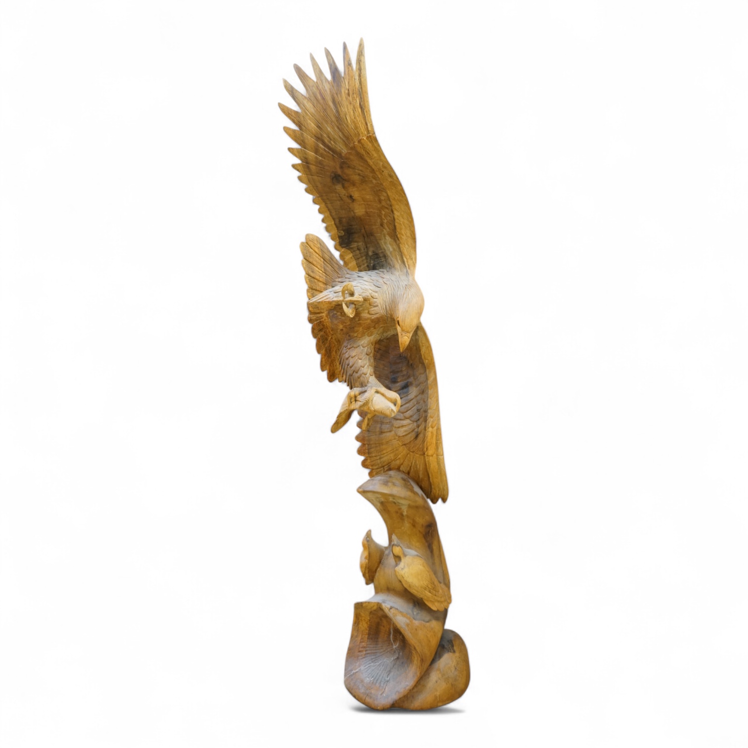 A large carved wood sculpture of an eagle and prey, 102cm high